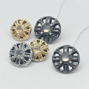 Starburst rhinestone metal buttons grouped in gold and gunmetal with a starburst pattern of faceted rhinestones