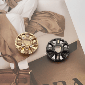Starburst rhinestone metal buttons styled on cloth with a starburst pattern of faceted rhinestones