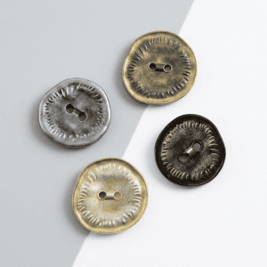 Assorted vintage two hole buttons with an irregular textured rim in antique bronze, silver and black, metal sew-through buttons for coats and crafts