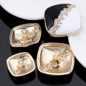 Cream square rhinestone enamel buttons with faceted rhinestones in a metal frame