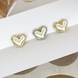 Vintage heart pearl buttons styled on fabric with a faux pearl finish and gold-tone edge