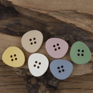 Triangle resin buttons in assorted pastel colors, rounded triangle sew-through buttons