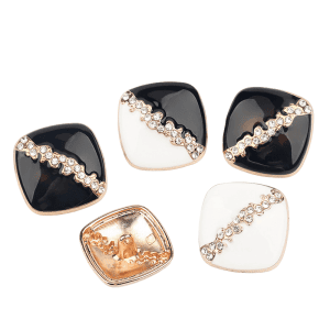Assorted square rhinestone enamel buttons in black and cream tones with faceted rhinestones