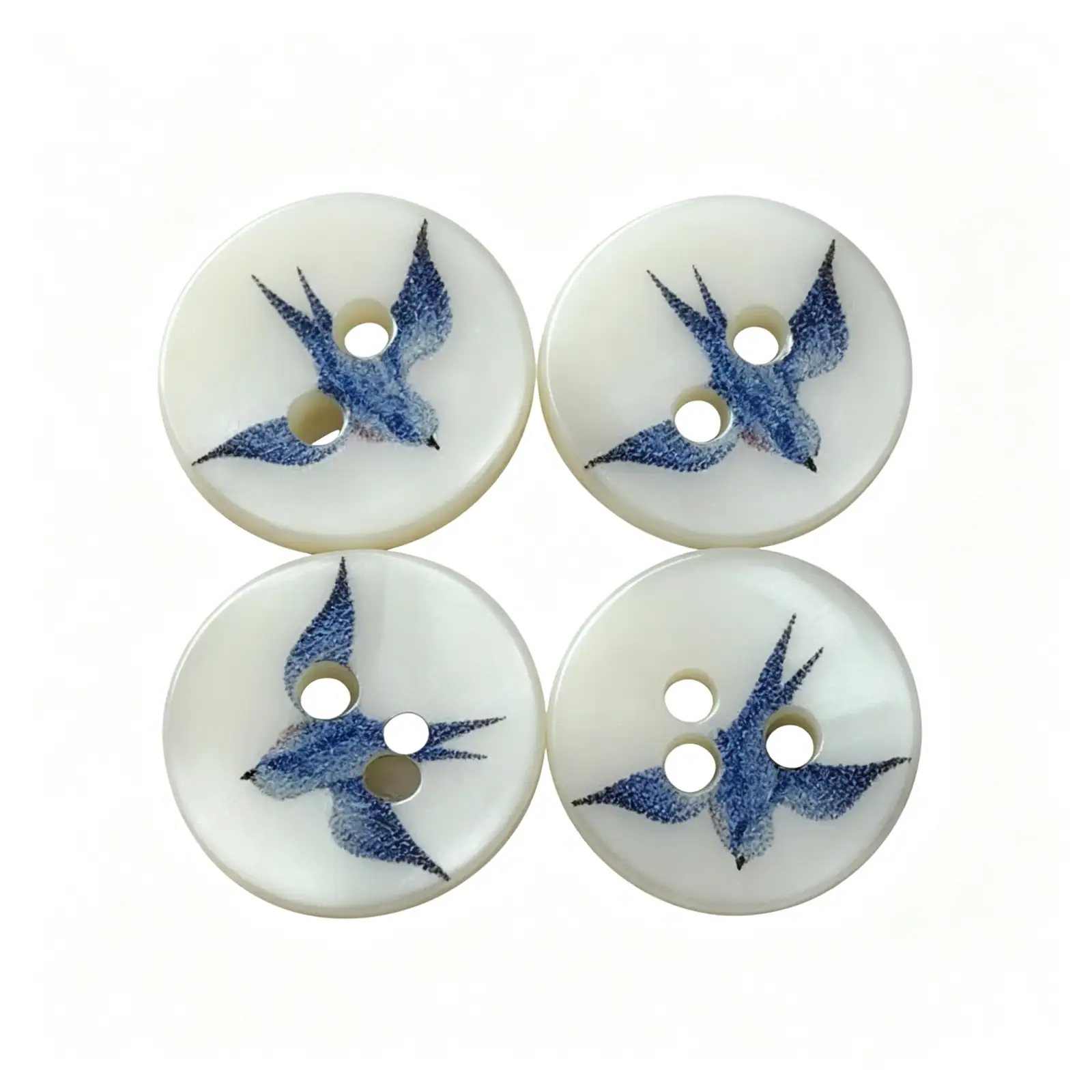 Four blue swallow shell buttons arranged in a square, showing the printed bird design at different angles