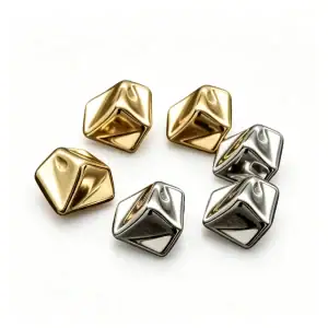 Gold-tone and silver-tone cone metal buttons with shank back on a white background