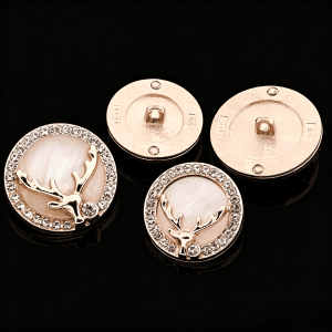 Assorted deer rhinestone shell buttons on a black background with a deer design and faceted rhinestones