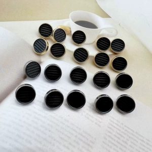 Black pedestal metal shank buttons grouped together with a raised pedestal shank