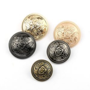 Silver, gunmetal and gold lion crest buttons with a raised heraldic emblem and beaded rim on a white background, sew-on metal buttons for blazers and coats
