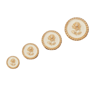 Cream rose enamel metal buttons grouped together with a gold-tone rose design