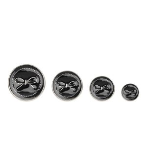 Black bow enamel buttons with a gold-tone metal frame and a bow design