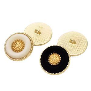 Black and cream vintage flocked buttons with a soft velvet-look surface and gold-tone rim