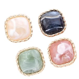 Marble resin buttons with gold trim in navy, green, pink and cream marbled tones
