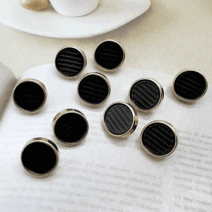 Gunmetal pedestal metal shank buttons grouped on a white background with a raised pedestal shank