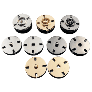 Two-part sew-on metal snap buttons showing the decorative tops and press-stud sockets in assorted metal tones, buttonhole-free fasteners for jackets and knitwear