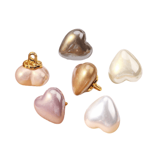 Heart faux pearl buttons with a gold flower grouped in cream, champagne and pink pearl tones