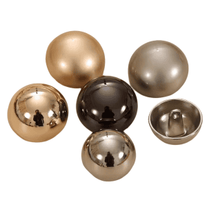 Matte gold mushroom dome buttons with a rounded metal half-ball shape and shank back, understated buttons for cardigans and blazers