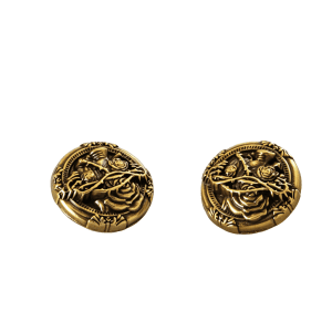 Close-up of vintage vine metal buttons with an embossed vine pattern in antique bronze-tone