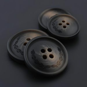 Dark brown resin leaf pattern buttons with an embossed leaf design and four sew-through holes