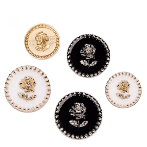 Rose enamel metal buttons grouped in black and cream with a gold-tone rose design
