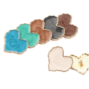 Assorted heart enamel buttons with gold trim in blue, brown and cream tones