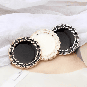 Vintage chain edge buttons with braided metal rims and enamel centers, in gold and silver with black and cream centers, for blazers and cardigans