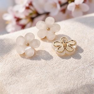 Cherry blossom flower buttons with white petals and a gold-tone metal center, sakura-shaped shank buttons for cardigans, blouses and DIY sewing
