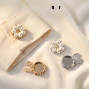 Pearl flower cufflink covers on a shirt cuff, faux pearl petals with a rhinestone center and snap-on clip, for a cufflink look