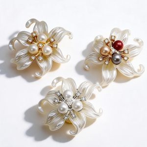 A pair of multicolor faux pearl lily button covers with colorful rhinestones and faux pearl centers, snap-on