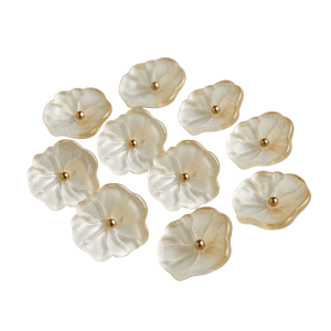 Group of frosted faux jade flower buttons scattered on a white background