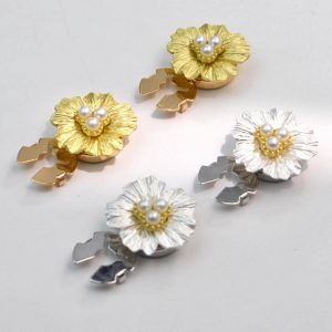 Vintage metal flower button covers with a faux pearl center in gold-tone and silver-tone, snap-on, sold as a pair