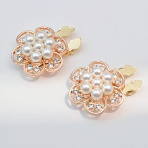 Rhinestone button covers with a faux pearl flower center in a rose gold-tone six-petal frame, snap-on, sold as a pair