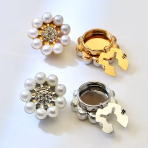 Gold-tone pearl sunflower button cover with a ring of faux pearls around a rhinestone center, snap-on