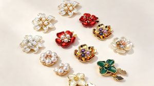 No-sew button covers in pearl, flower, enamel and rhinestone styles that snap over existing shirt buttons, decorative button covers by Shancco