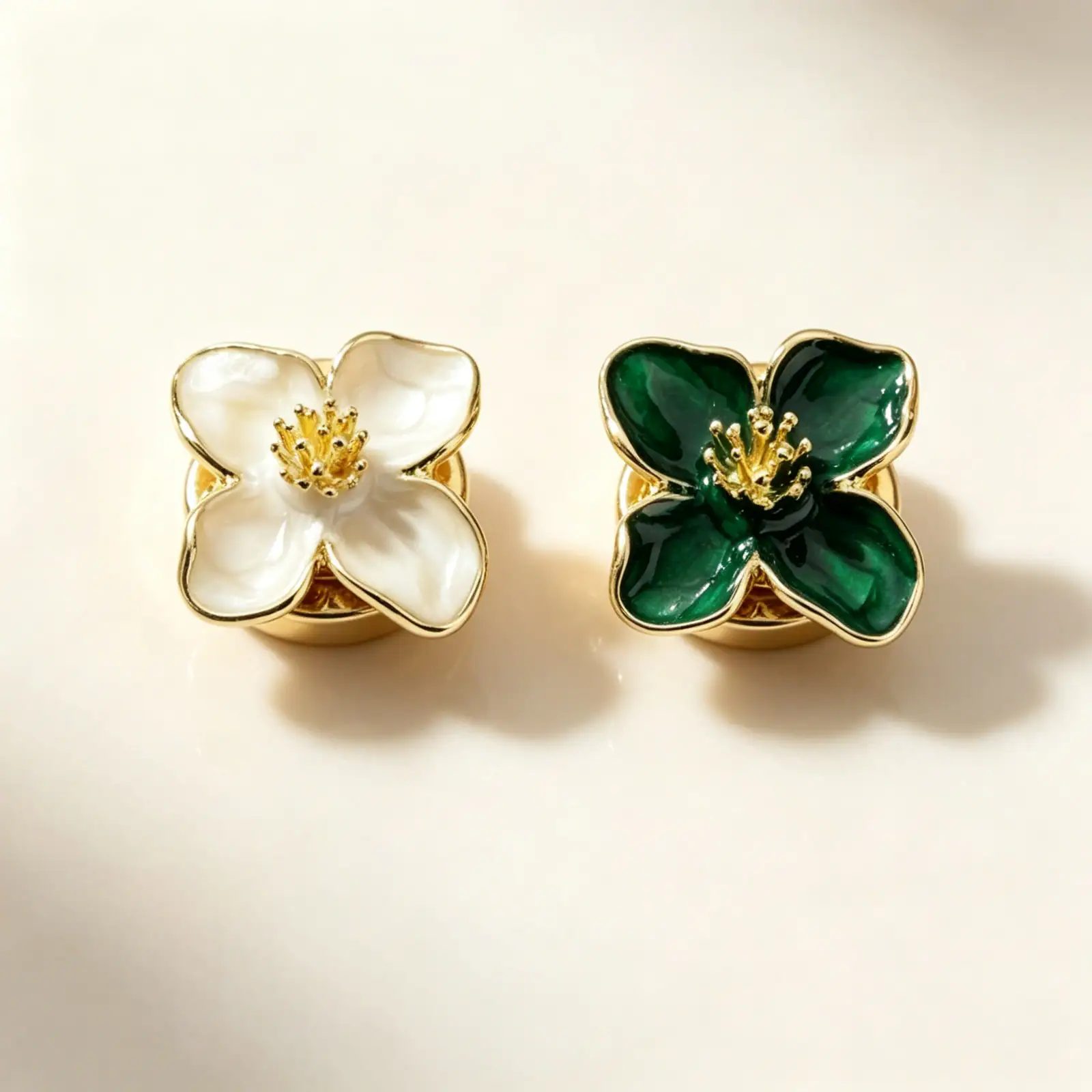 White and green enamel flower button covers with gold-tone petals and back clips