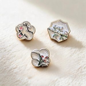 A group of plum-orchid-bamboo-chrysanthemum metal buttons in plum blossom, orchid and bamboo designs, gold-tone metal buttons with a shank back