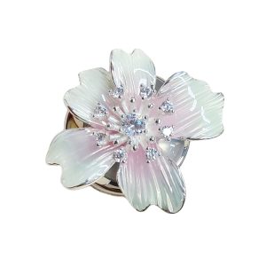 Iridescent cyan French cuff flower button cover, soft pearl-look iridescent enamel flower with faceted bead accents on a silver-tone metal base with a hinged clip back