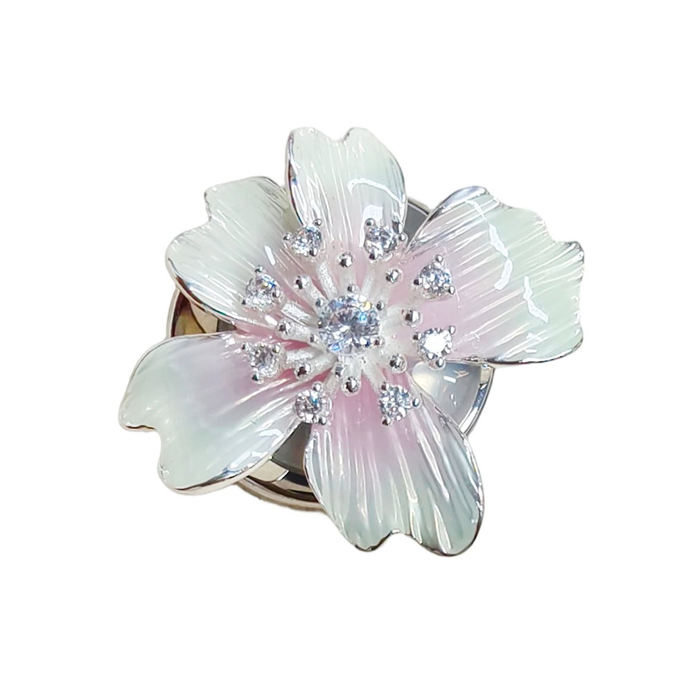 Iridescent cyan French cuff flower button cover, soft pearl-look iridescent enamel flower with faceted bead accents on a silver-tone metal base with a hinged clip back