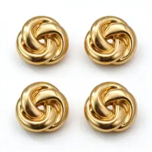 Four gold-tone knot cufflink covers arranged on a white background
