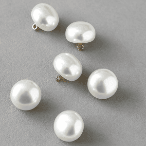 Half round pearl buttons with a smooth ivory faux pearl dome and gold-tone metal shank, five sizes for sewing
