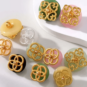 Jade filigree buttons in white, yellow, pink, green and black faux jade glass with openwork gold-tone metalwork, in 11.5mm filigree and 15mm clover styles