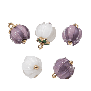 Lily of the valley buttons in handmade purple and white glass shaped like ribbed flower buds, with gold-tone loops, approx. 12mm