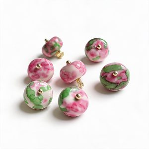 Red rose stone button showing the rose-red pattern and gold-tone alloy shank back