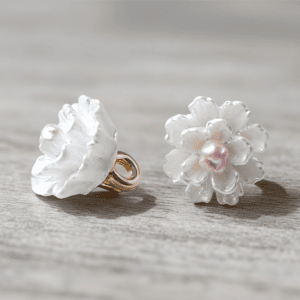 Camellia flower buttons with layered white petals and a pink center on a gold-tone shank, 10mm, for cardigans and DIY sewing