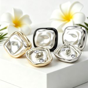 Flat lay of irregular cardigan buttons in mixed metal tones with white flowers