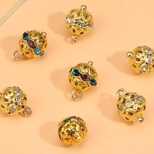 Clear and multicoloured rhinestone ball buttons shown together for colour comparison