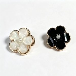 Five petal flower buttons in white and black, gold-tone metal frame with glossy petals and a faux pearl center