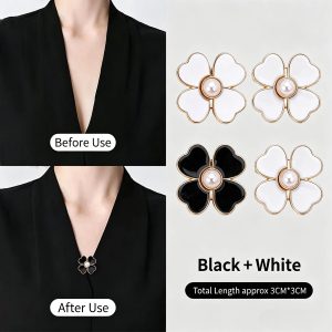 Mixed black and white clover pearl brooches, shown closing the V-neckline of a black top before and after use