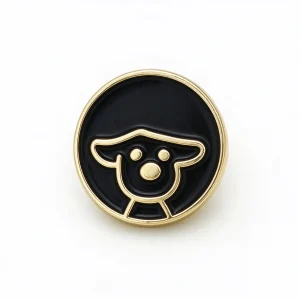 Dog enamel button in glossy black with a gold-tone rim and a raised gold-tone puppy face outline
