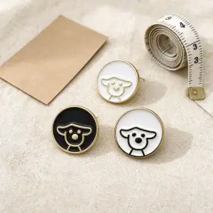 Three dog enamel buttons on natural linen with a tape measure, 11mm shank buttons laid out for a sewing project