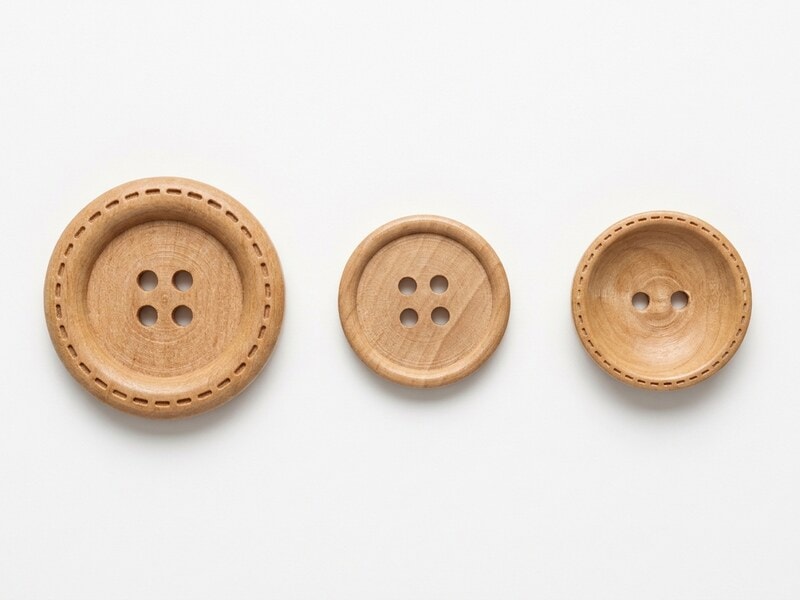 Natural wood buttons in three styles, wide-edge dashed four hole, thin-edge four hole and bowl shape two hole